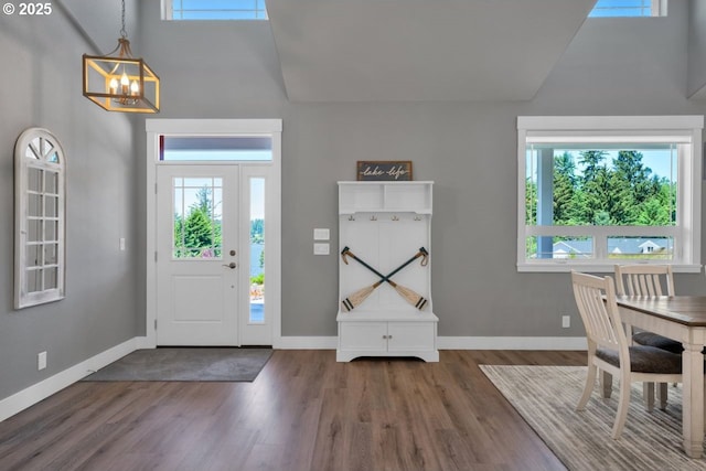83591 Sauter Dr, Florence, OR 97439 - entrance foyer with a high ceiling, a chandelier, and wood finished floors