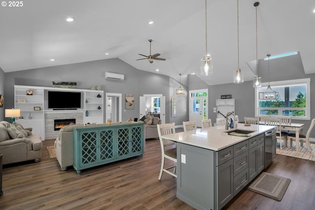83591 Sauter Dr, Florence, OR 97439 - kitchen featuring gray cabinetry, open floor plan, an AC wall unit, ceiling fan, and high vaulted ceiling