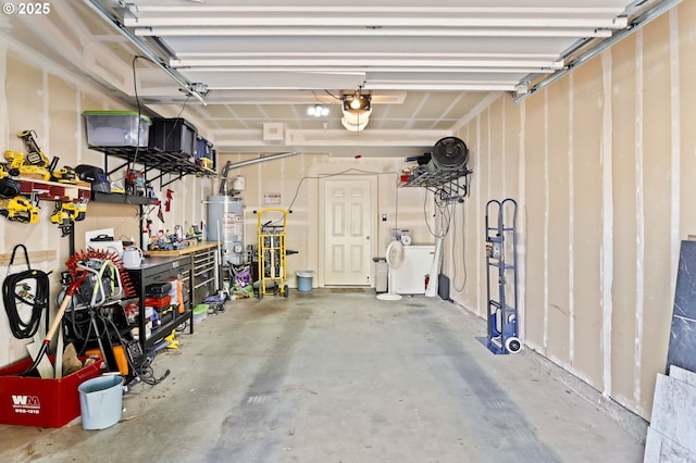 14600 SW Magpie Ln Unit 102, Beaverton, OR 97007 - garage featuring gas water heater, a garage door opener, and washer / clothes dryer