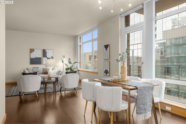 dining area featuring a chandelier and wood finished floors