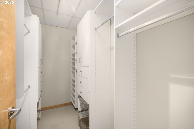 walk in closet with a drop ceiling