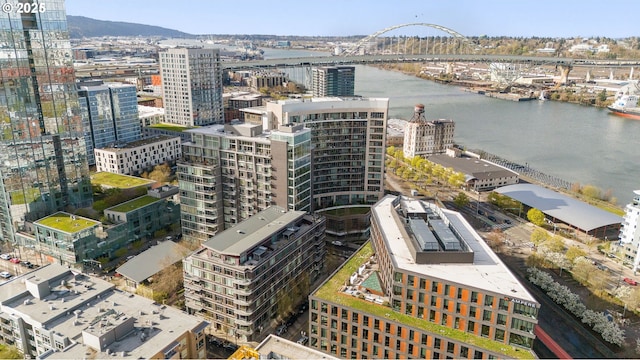 birds eye view of property featuring a water view and a city view