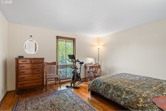 bedroom featuring wood finished floors