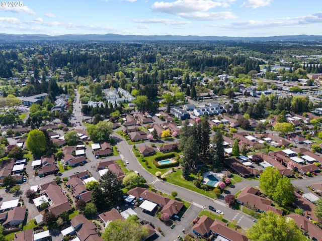 aerial view with a mountain view and a wooded view