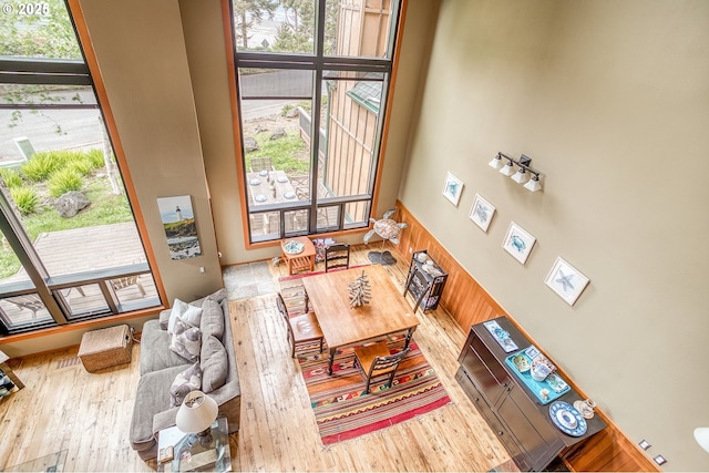 3360 NW Oceanview Dr, Newport, OR 97365 - living room with healthy amount of natural light, wood finished floors, and a high ceiling