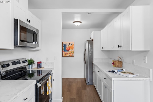 3235 SE 69th Ave, Portland, OR 97206 - kitchen with stainless steel appliances, dark wood-style flooring, and white cabinets