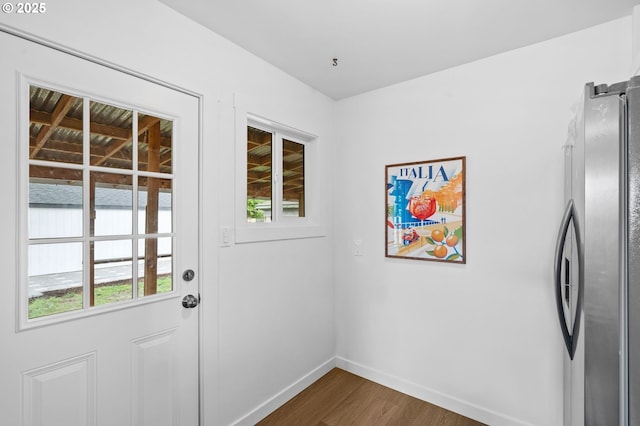 3235 SE 69th Ave, Portland, OR 97206 - doorway to outside featuring baseboards and dark wood-type flooring