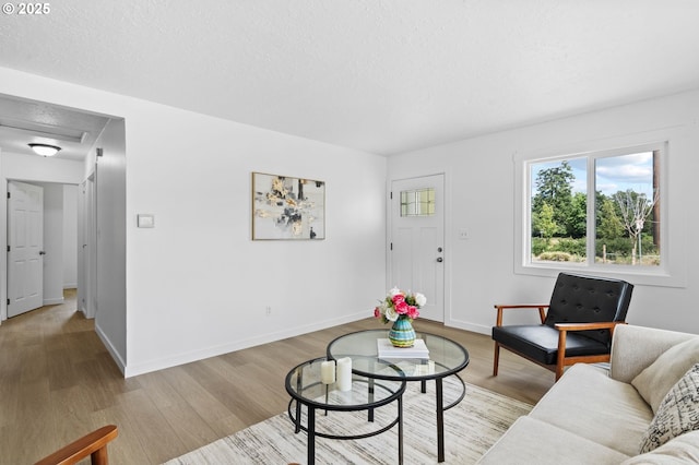 3235 SE 69th Ave, Portland, OR 97206 - living area featuring light wood-style floors and baseboards