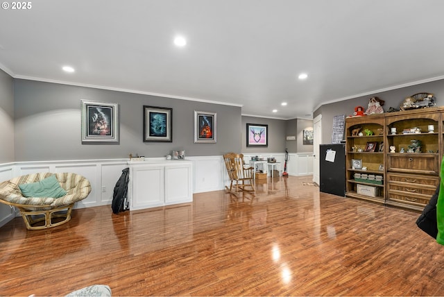 190 Walnut St, Myrtle Creek, OR 97457 - living area featuring crown molding, recessed lighting, a decorative wall, wainscoting, and wood finished floors