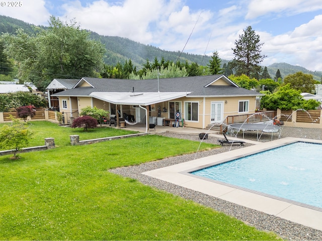 190 Walnut St, Myrtle Creek, OR 97457 - back of house with a mountain view, a patio, french doors, and an outdoor pool