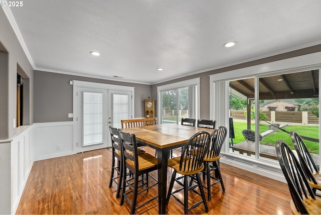 190 Walnut St, Myrtle Creek, OR 97457 - dining space with wood finished floors, ornamental molding, a wainscoted wall, french doors, and recessed lighting