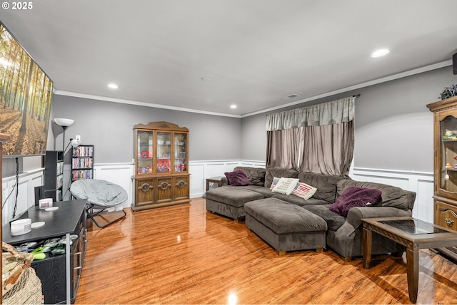 190 Walnut St, Myrtle Creek, OR 97457 - living room featuring ornamental molding, a wainscoted wall, light wood-type flooring, and a decorative wall