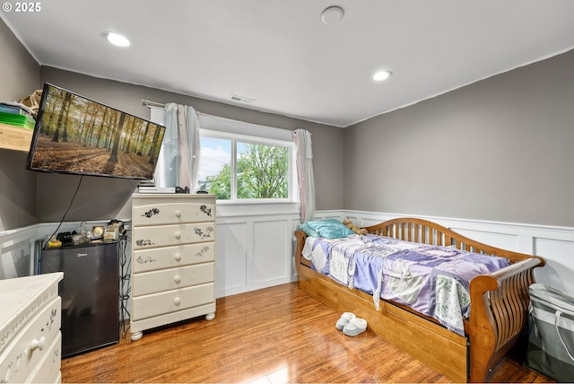 190 Walnut St, Myrtle Creek, OR 97457 - bedroom featuring a wainscoted wall, light wood-style floors, a decorative wall, and recessed lighting