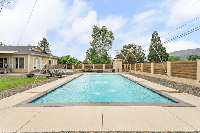 190 Walnut St, Myrtle Creek, OR 97457 - view of swimming pool featuring french doors, a patio, and a fenced backyard