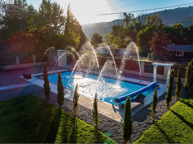 190 Walnut St, Myrtle Creek, OR 97457 - view of swimming pool with a mountain view and fence