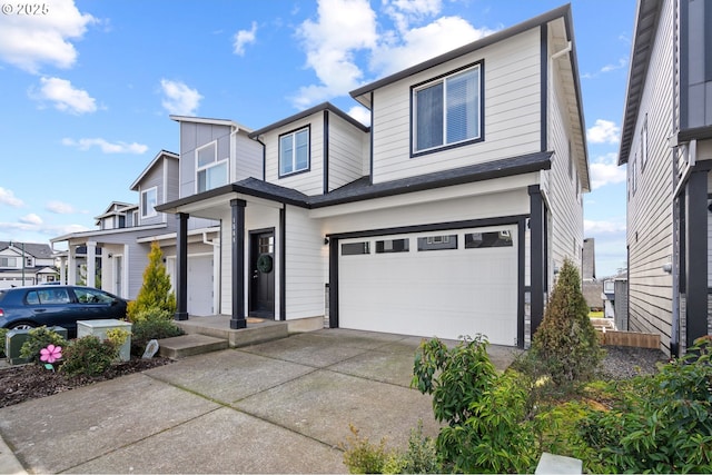 view of front of home with a garage and concrete driveway