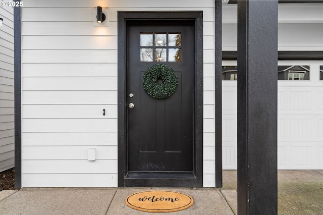 entrance to property featuring a garage