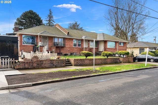 ranch-style house with brick siding