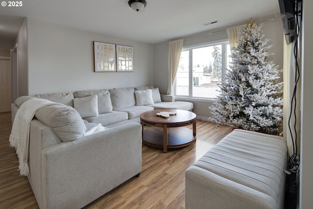 living room with light hardwood / wood-style floors