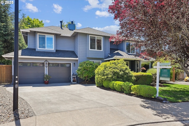 7826 SW Skyhar Dr, Portland, OR 97223 - traditional-style house featuring an attached garage, concrete driveway, a chimney, and a shingled roof