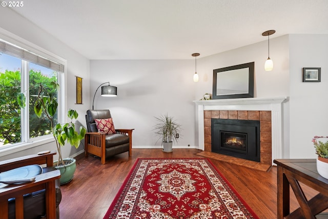 7826 SW Skyhar Dr, Portland, OR 97223 - living room with wood finished floors, a fireplace, and baseboards