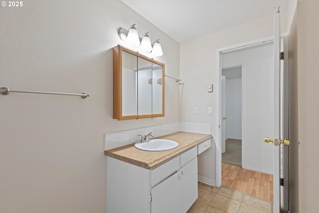 bathroom featuring vanity and tile patterned flooring