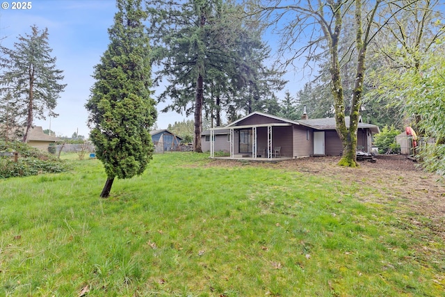 view of yard featuring fence