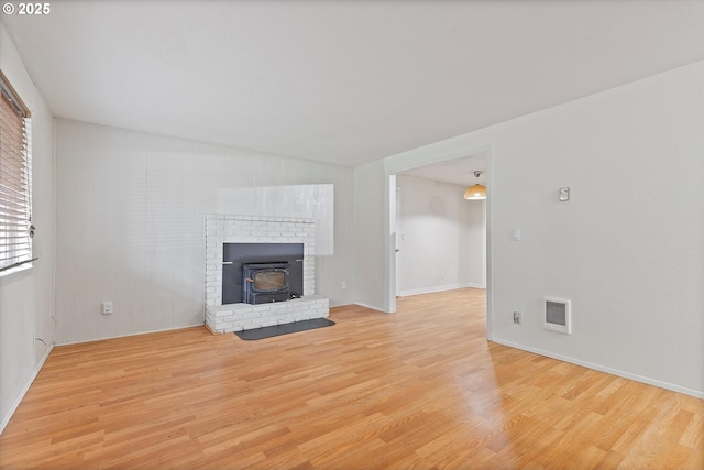 unfurnished living room featuring light wood-style floors and visible vents