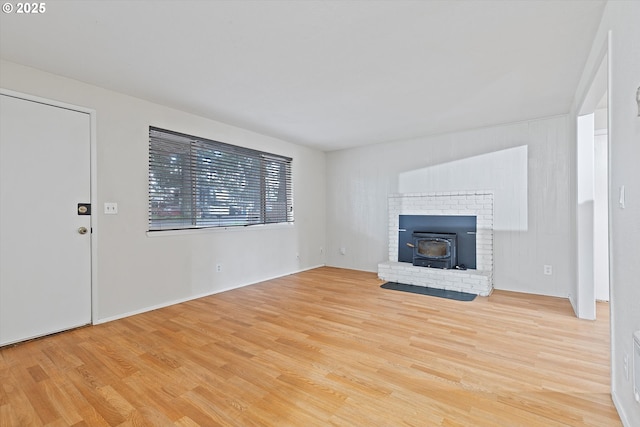 unfurnished living room featuring wood finished floors