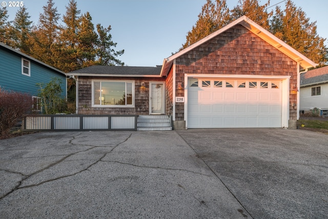 ranch-style home featuring a garage