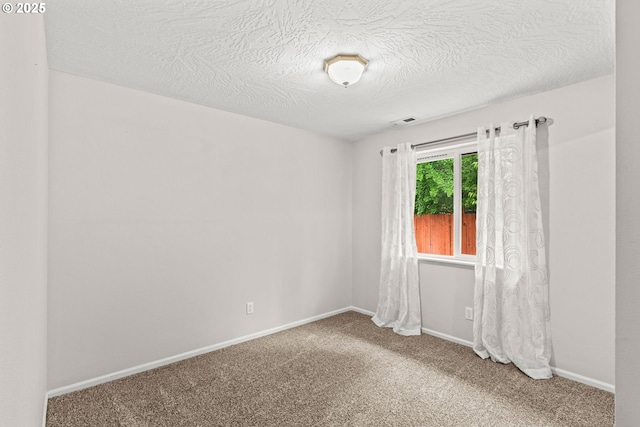 3191 Zinnia St, Eugene, OR 97404 - carpeted empty room with baseboards and a textured ceiling