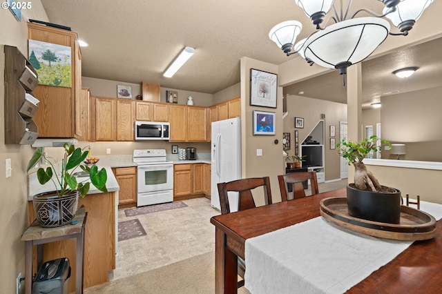 17011 SW Red Leaf Pl, Sherwood, OR 97140 - kitchen with white appliances, light countertops, and light brown cabinets