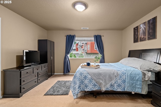 17011 SW Red Leaf Pl, Sherwood, OR 97140 - bedroom with light colored carpet, a textured ceiling, and baseboards