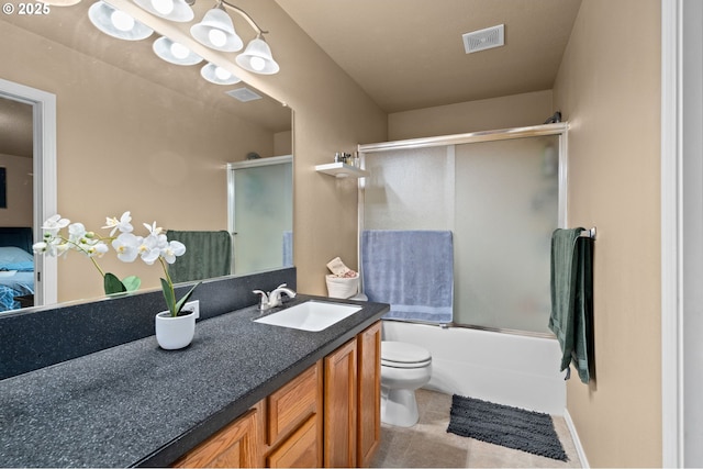 17011 SW Red Leaf Pl, Sherwood, OR 97140 - bathroom featuring vanity, toilet, bath / shower combo with glass door, and tile patterned floors