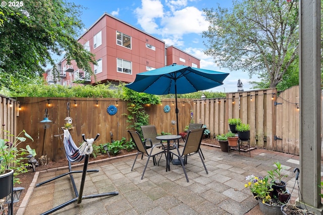 17011 SW Red Leaf Pl, Sherwood, OR 97140 - view of patio featuring a fenced backyard and outdoor dining space