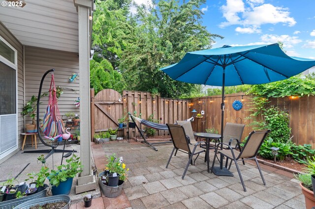 17011 SW Red Leaf Pl, Sherwood, OR 97140 - view of patio / terrace with a gate, fence, and outdoor dining space