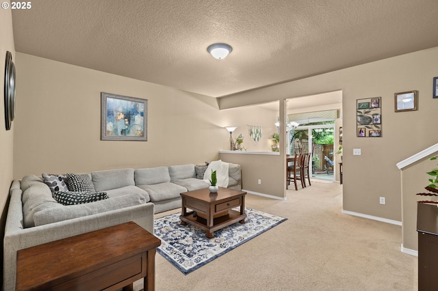17011 SW Red Leaf Pl, Sherwood, OR 97140 - living room featuring baseboards, light colored carpet, and a textured ceiling
