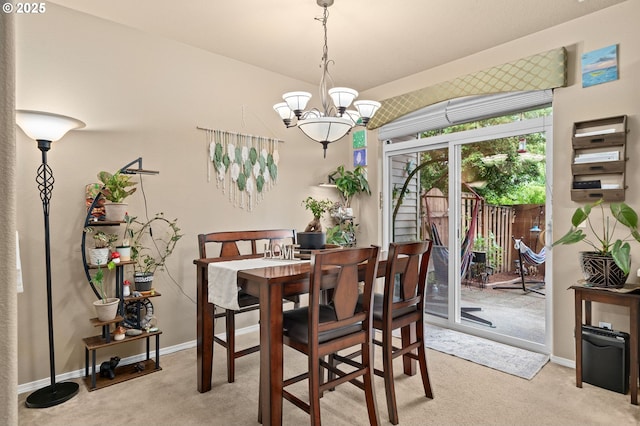 17011 SW Red Leaf Pl, Sherwood, OR 97140 - dining area featuring light colored carpet, a chandelier, and baseboards