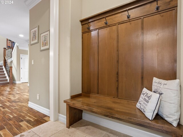 mudroom featuring ornamental molding