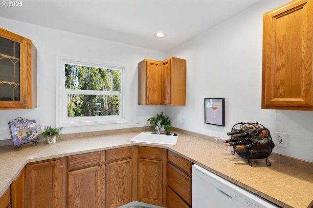 1013 NE Birchwood Dr, Hillsboro, OR 97124 - kitchen featuring a sink, glass insert cabinets, white dishwasher, brown cabinets, and light countertops