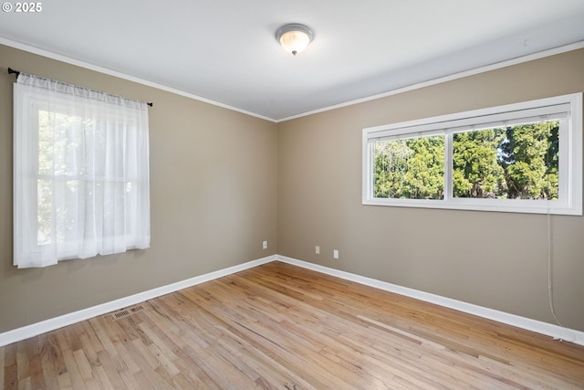 1013 NE Birchwood Dr, Hillsboro, OR 97124 - empty room featuring baseboards, ornamental molding, wood finished floors, and visible vents