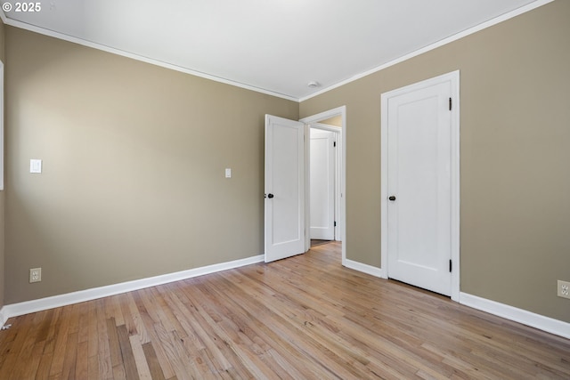 1013 NE Birchwood Dr, Hillsboro, OR 97124 - unfurnished bedroom with light wood-type flooring, baseboards, and ornamental molding