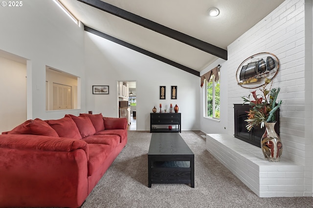 living area featuring carpet floors, lofted ceiling with beams, and a fireplace