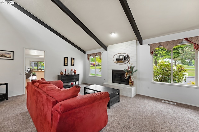 living room with visible vents, a brick fireplace, beamed ceiling, baseboards, and carpet flooring