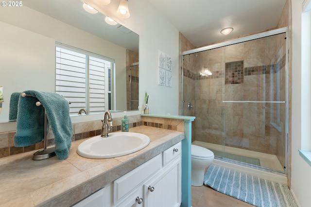 full bathroom with vanity, visible vents, toilet, and a shower stall