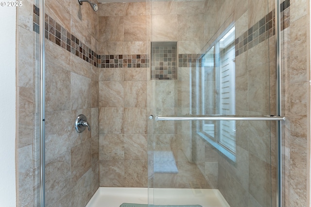 bathroom featuring a shower stall