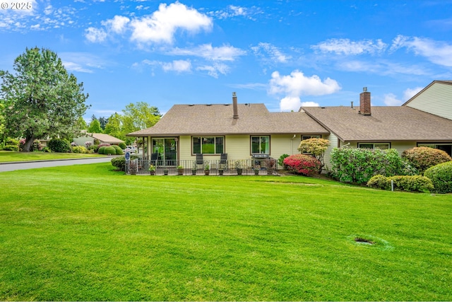 ranch-style home with a front lawn