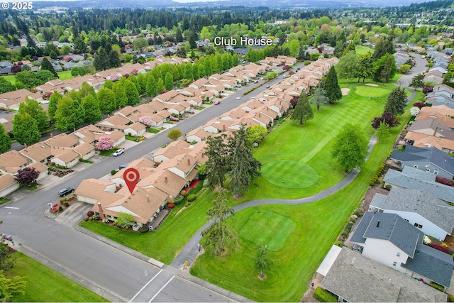 drone / aerial view featuring golf course view and a residential view