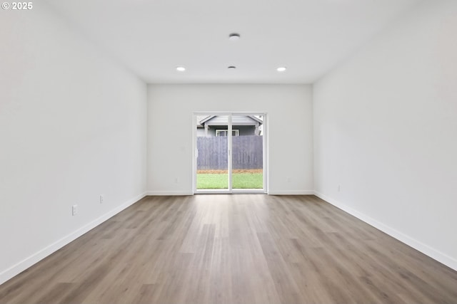 1912 NW 18th Ave, Battle Ground, WA 98604 - unfurnished room featuring baseboards, wood finished floors, and recessed lighting