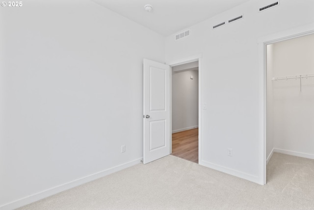 1912 NW 18th Ave, Battle Ground, WA 98604 - unfurnished bedroom with baseboards, visible vents, carpet floors, and a spacious closet